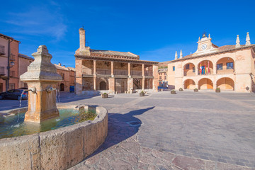 main square with fountain, church of San MIguel (Saint Michael), from twelfth century, and town hall public building, from sixteenth century, in old town of Ayllon village, Segovia, Spain, Europe

