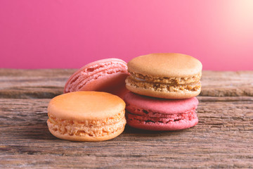 Different types color of macaroons on Old grunge wooden background