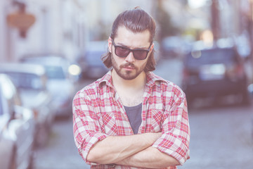 Fototapeta premium Handsome young guy posing on the street.