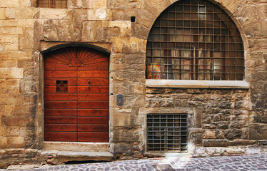 Bergamo, Italy - August 18, 2017: The front door of an old house.