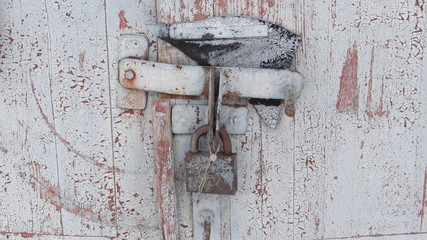 Grey door with a lock.