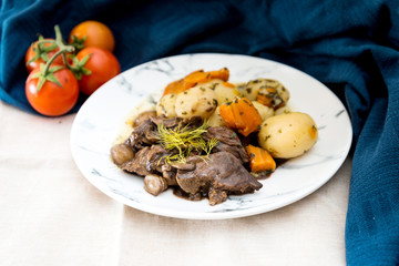 Beef meat stewed with potatoes-Traditional French cuisine Beef Bourguignon potatoes carrots in persillade
