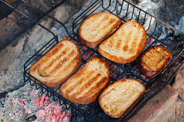 Sliced bread barbecue. Preparation at the stake