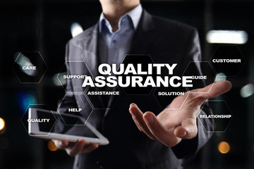 Quality assurance concept on the virtual screen. Business concept.