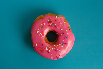 A pink glazed donut