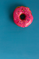 A pink glazed donut
