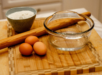 Ingredients for dough on wooden table. Close up