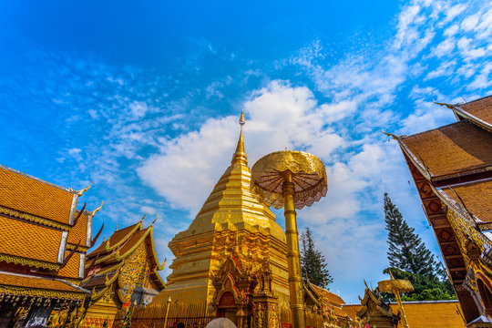 golden pagoda in wat Phrathat Doi Suthep under blue sky.Temple is tourist attraction of Chiang Mai, Thailand.