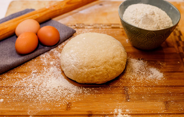 Ingredients for dough on wooden table. Close up