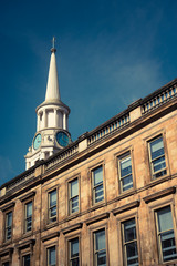 Fototapeta na wymiar Old Hospital Clock Tower and Sandstone Terrace in Glasgow, Scotland