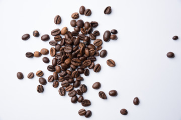 Mixture of different kinds of roasted coffee beans on white. Coffee Background. Isolated