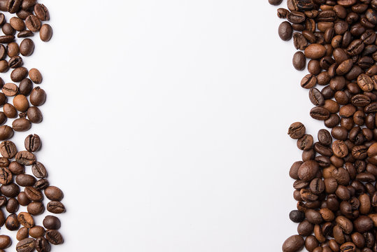 Frame of roasted coffee beans isolated on white may use as background or texture