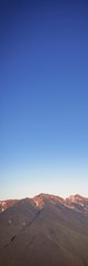 Clouds passing over a mountain range