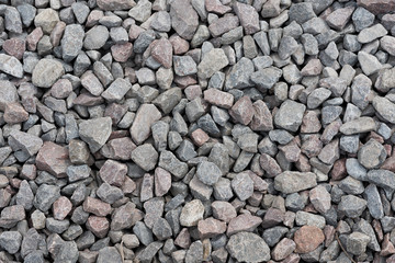 Grey river stone rock pattern texture background on wall