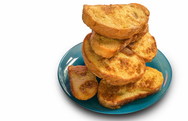 stack of fried croutons toasts for Breakfast in a plate for morning coffee on white isolated background