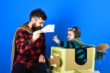 Adopting a child. Adopted boy in new family. Portrait of funny kid on a background. Family games indor.