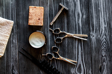 Tools for cutting beard barbershop top view on wooden background