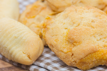 pineapple cookies and Oatmeal cookies on wooden plate