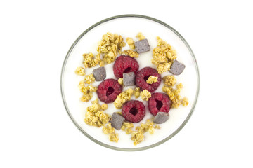 Cup of yogurt with muesli and raspberries and chocolate