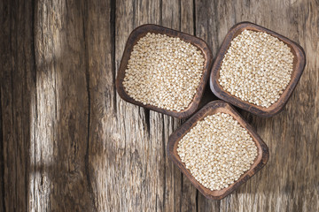 quinoa beans in bowl on rustic wooden background