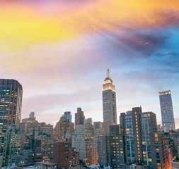 Manhattan skyline at sunset, aerial view from rooftop