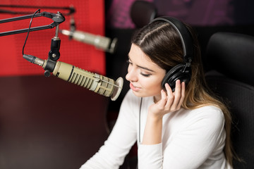 Radio announcer broadcasting show in a studio