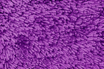 dark purple fabric doormat texture background.