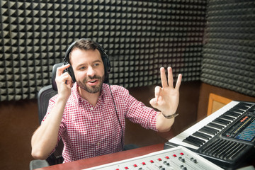 Sound technician gesturing start the show
