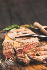 Grilled steak on wooden cutting board
