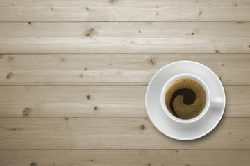 coffee cup on wooden table, view from above
