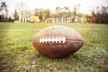 american football on the field - defocused players in the background