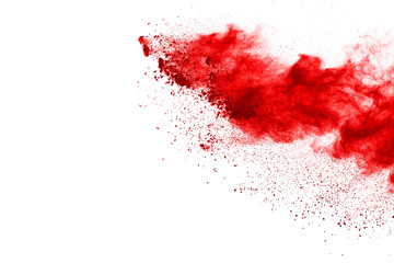 Red powder explosion on white background. Colored cloud. Colorful dust explode. Paint Holi.