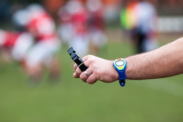 close up on hands of american football referee