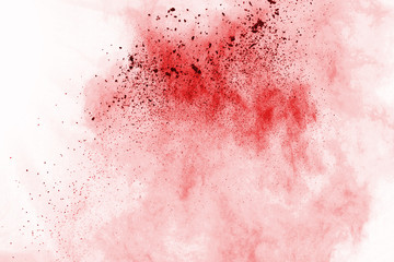 Red powder explosion on white background. Colored cloud. Colorful dust explode. Paint Holi.