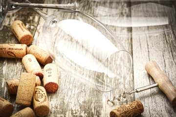 Detail of wine glasses and corks in filtered old vintage style