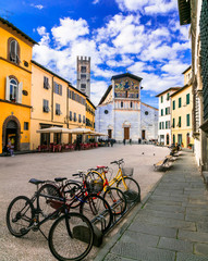 Italy - art and religion. Lucca medieval town - square with San Frediano chucrh - obrazy, fototapety, plakaty