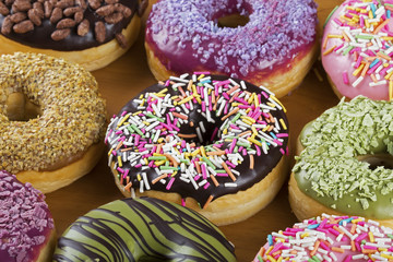 Close up of colorful and delicious donuts