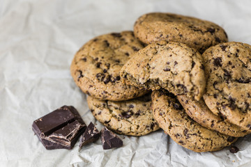 Freshly Baked Chocolate Cookies on Baking Paper. Sweet Biscuits. Homemade pastry.