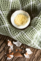 Hard-boiled egg in kitchen towel (Very Shallow Depth of Field, Focus two thirds into the image)