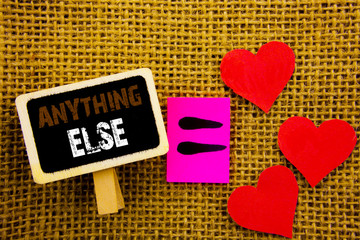 Writing text showing  Anything Else. Concept meaning Ask Asking Question to Have Answer written on blackboard equation Meaning Love Heart on the textured background