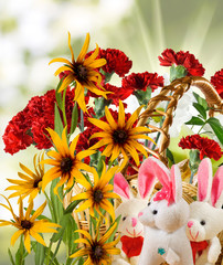 image of toy hares and flowers in the garden
