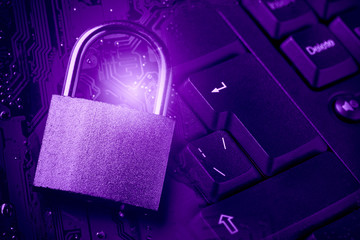 Padlock on computer motherboard and keyboard. Internet data privacy information security concept....