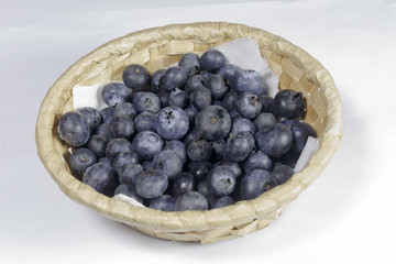 Blueberry in a basket on a white background, Ready to Eat, Vegan food.
