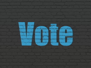 Obraz premium Political concept: Painted blue text Vote on Black Brick wall background
