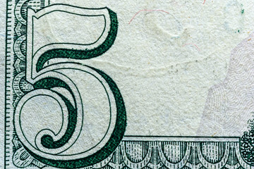 fragment of a banknote five American dollars