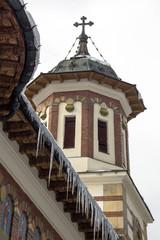Elements of the Orthodox Church with icicles. Sinai, Romania.