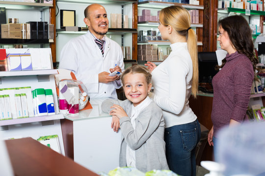 Pharmacist helping customers