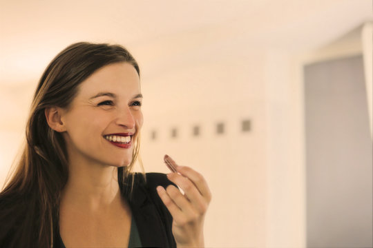 Smiling woman wearing lipstick