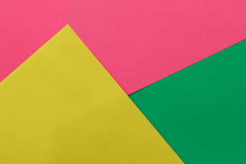 Green and pink and yellow color paper background