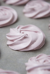 Marshmallow, Meringue, Zephyr over Baking Paper ready for Drying. Pink Dessert with Strawberry. Step by Step process.